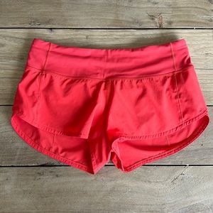 Red/coral Lululemon 2.5” shorts